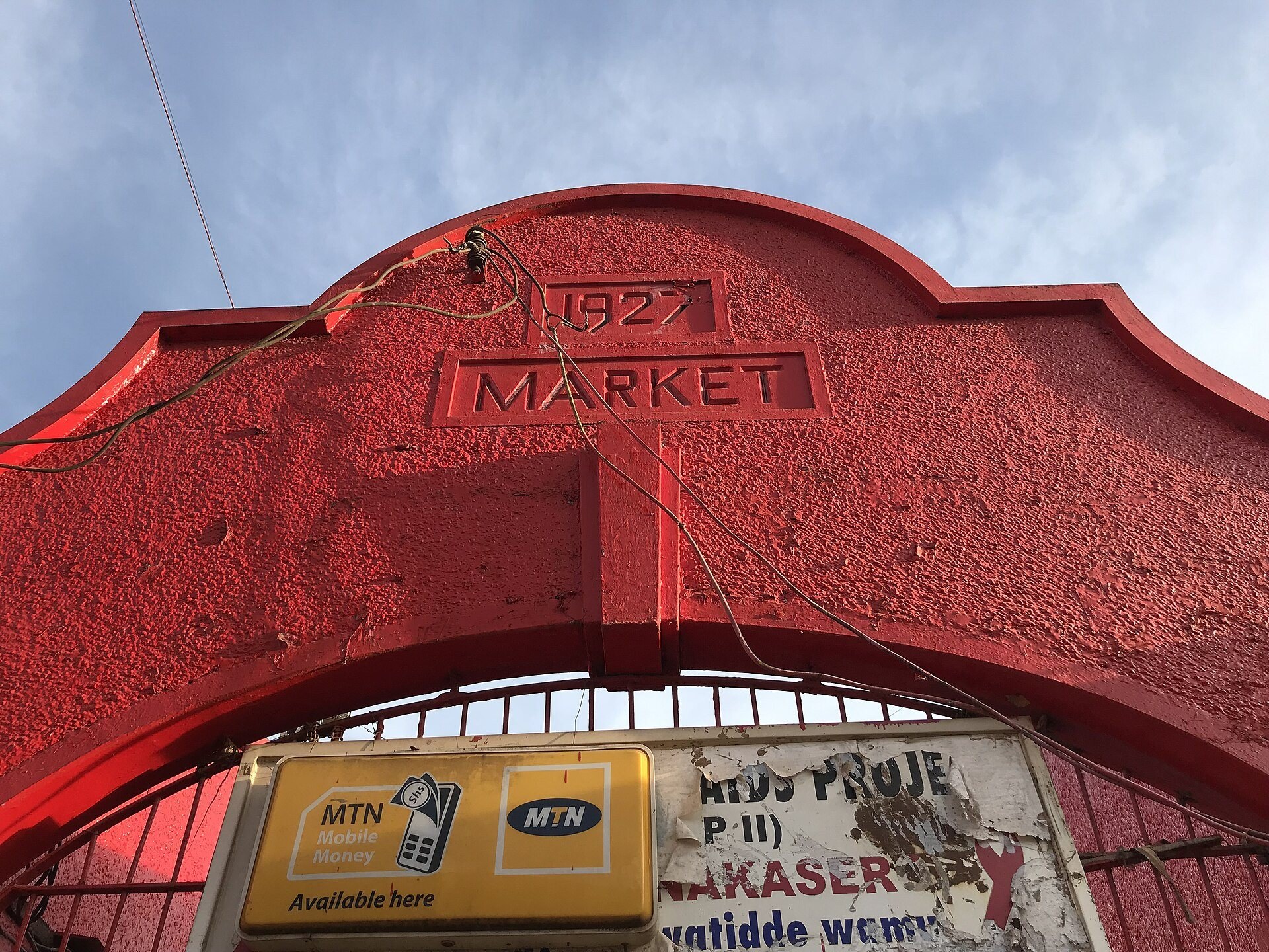 A red arched gateway with the word Market and the year 1927 moulded into it